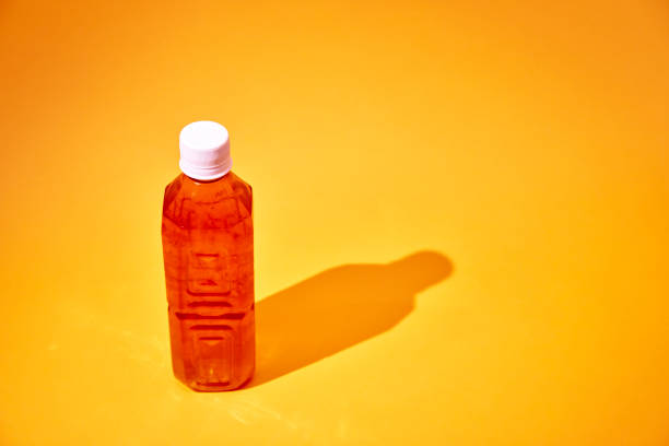 Iced Tea in Recycled PET Plastic Bottle on Yellow Background