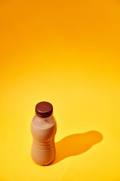 Coffee Latte in Recycled PET Plastic Bottle on Yellow Background