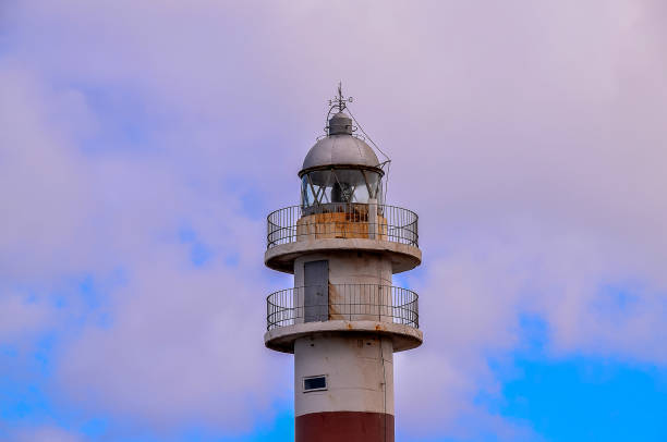 istock A lighthouse is tall and has a weather vane on top 2155920943