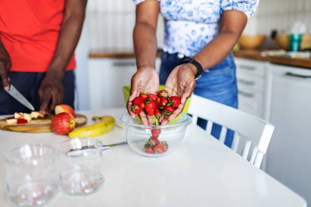 istock Closeup of hands with strawberry 2155922402