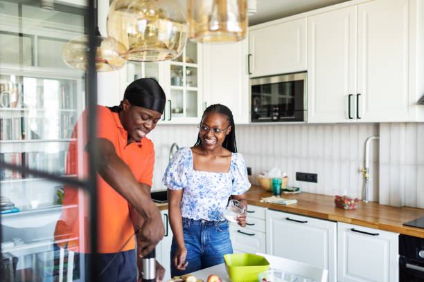 istock Young black couple cooking strawberry smoothie 2155922667