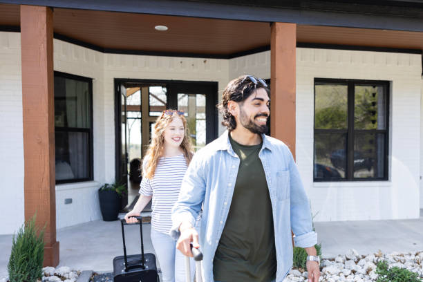 istock Excited young couple leave home for vacation trip 2155928073