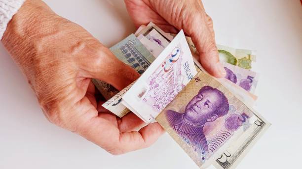 istock paper money and human hand 2155928475