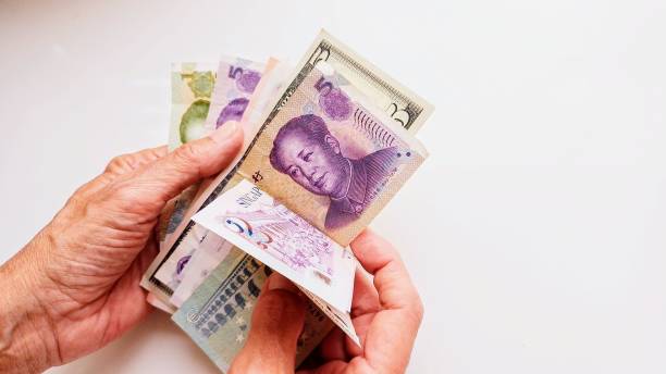 istock paper money and human hand 2155928481