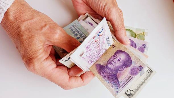 istock paper money and human hand 2155928490