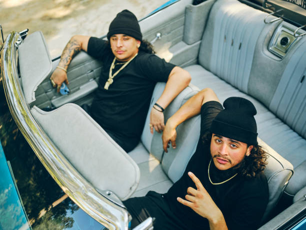 istock Young Men in a Vintage Car Looking at the Camera 2155934896