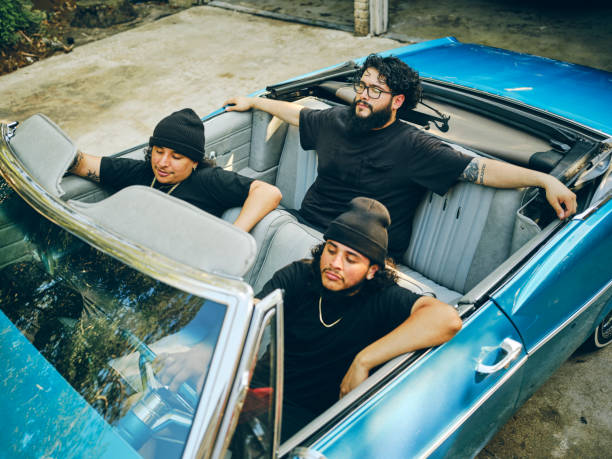 istock Young Men in a Convertible Lowrider Car 2155934941