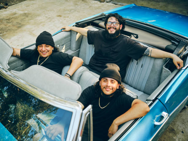 istock Young Men in a Vintage Car Looking at the Camera 2155934967
