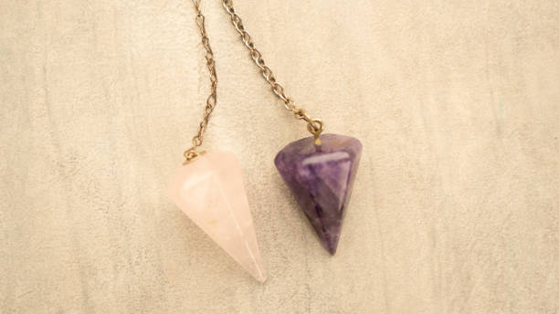 istock Purple and Rose Quartz Pendulums 2155935025