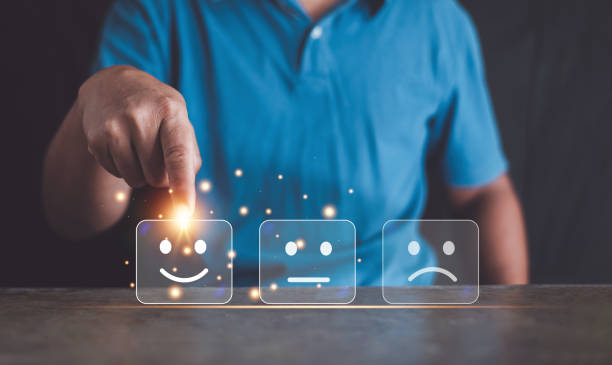 istock Customer satisfaction survey concept, Hand of a businessman select a smiley face on virtual graphic cube block, Best excellent business services rating customer experience. 2155940670