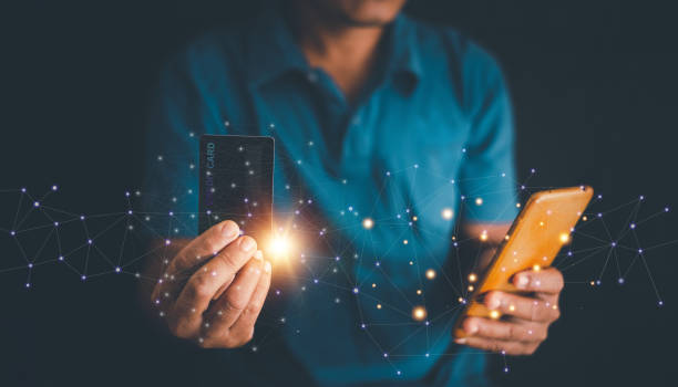 istock Man's hands holding smartphone and using credit card for online shopping, E-commerce Internet banking concept, Spending money, browsing banking service, checking balance, ordering in internet. 2155940714