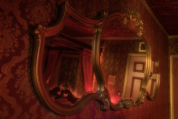 istock gold gilded mirror on moody red victorian wall 2155942432