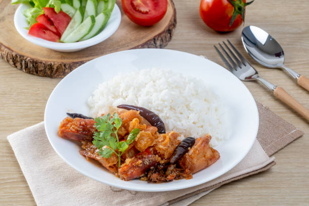 istock Shrimp with sauce over rice on the wooden table 2155943920