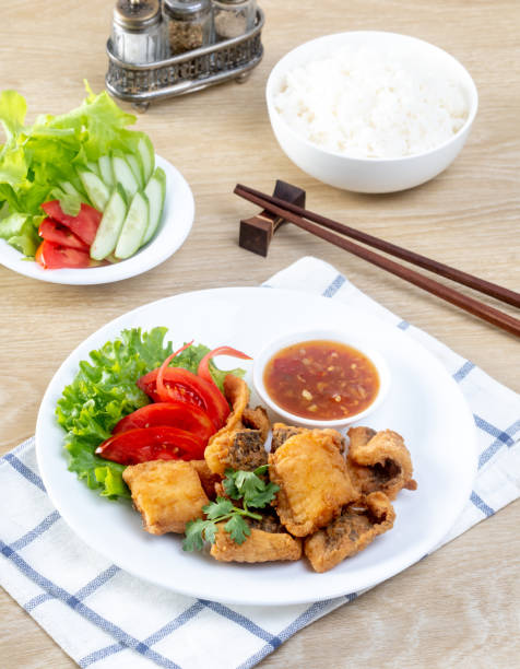istock Crispy fried fish on the wooden table 2155943928
