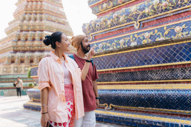 istock Tourist couple walking through ancient architecture on vacation 2155944391