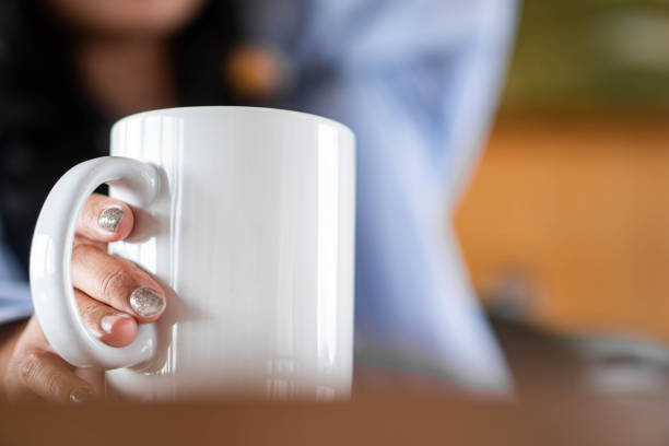 istock White coffee mug with black coffee on wooden table 2155946755
