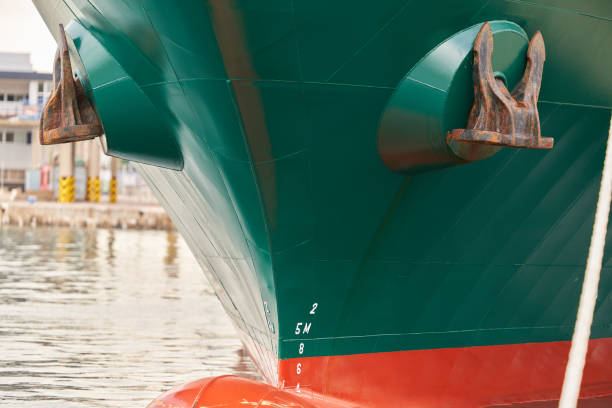 istock Rusty green boat anchors viewed from the front side 2155947556