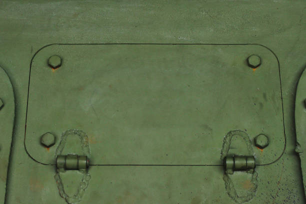 Special technological hole with door hinges. Armored vehicle hatch. Fragment of the side of the tank.