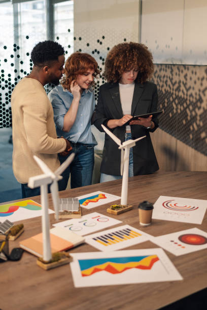 istock Interracial ecology engineers with tablet doing research for green economy 2155948113