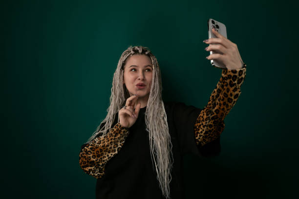 istock Woman Taking Selfie With Cell Phone 2155949399
