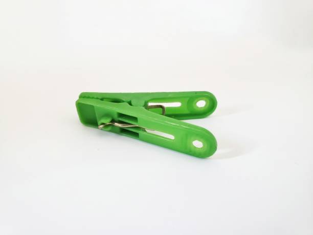 istock Green clothes pin isolated in a white background 2155952647