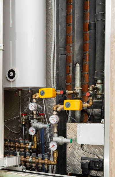 istock Water supply system: tank with pipes and appliances 2155954777