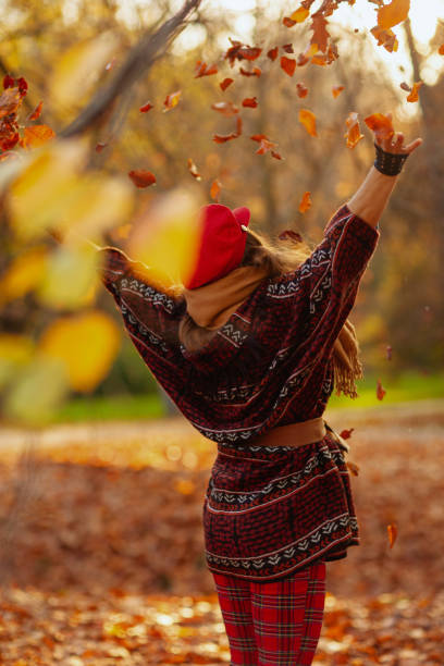 istock Seen from behind woman in red hat rejoicing 2155955214