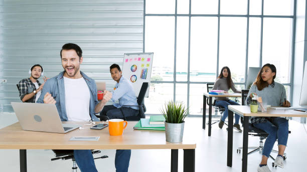 Office teamwork celebration working happiness Happy business people dance expression together at office after job done complete in meeting room. Diversity people happy moment dance together in company