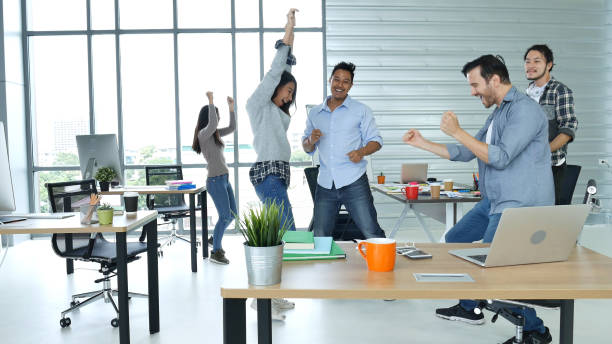 istock Office teamwork celebration working happiness Happy business people dance expression together at office after job done complete in meeting room. Diversity people happy moment dance together in company 2155956230
