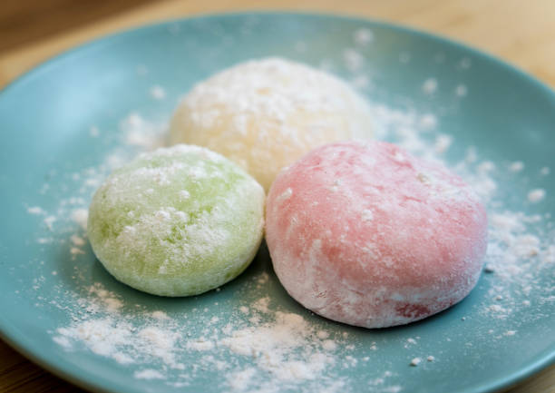 istock Different color delicious Japanese mochi on the blue plate 2155957500