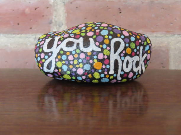 istock You rock kindness rock on shiny wooden surface 2155958869
