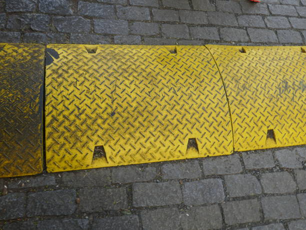 istock Speed bump painted yellow on road 2155959156