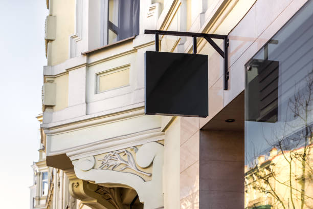 istock Mockup Of Restaurant White Signboard Hanging On The Wall 2155960493
