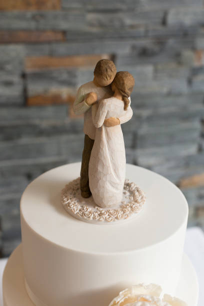 Beautiful white wedding cake decorated with flowers close up