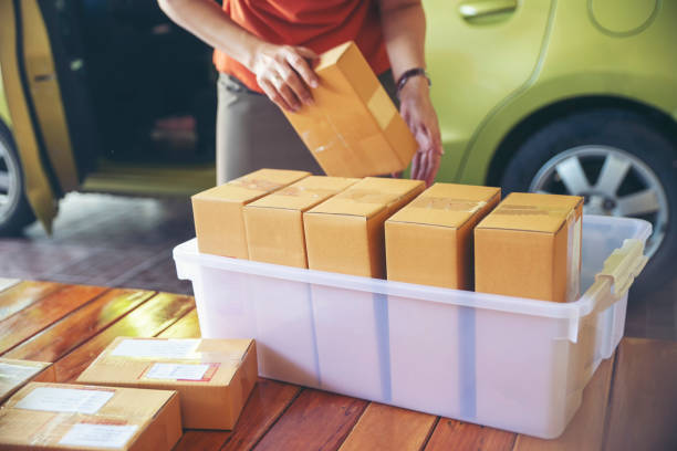 istock Business owner is preparing to pack Parcel Box Package for delivery to customers. 2155965874