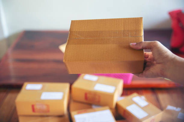 istock Business owner is preparing to pack Parcel Box Package for delivery to customers. 2155965882