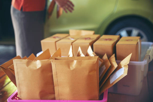 Business owner is preparing to pack Parcel Box Package for delivery to customers.