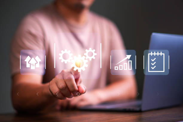 istock Business Automation and Artificial intelligence for business concept . Man using tablet and touch business automation software to optimise business process workflow. 2155968744