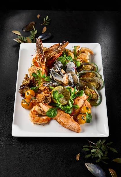 istock Gourmet Seafood Platter on Elegant Table Setting - Mussels, Salmon, Shrimp, Octopus 2155972163