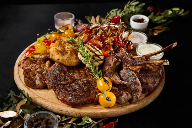 istock Sumptuous Grilled Meat Assortment With Vegetables on a Barbecue Setup 2155972199