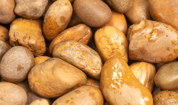 istock Round stones in the wall as an abstract background. Texture 2155973153