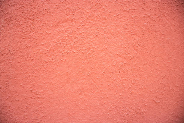 Orange concrete wall. Copy space. Close-up.