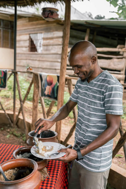 istock African man preparing ugali traditional dish on a rural kitchen 2155974044