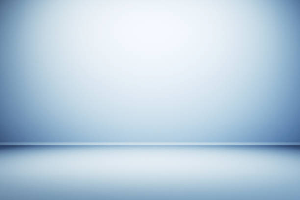 istock An empty blue room with a spotlight effect on the wall and floor, suitable for product presentations. 3D Rendering 2155975754
