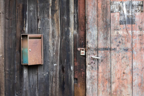 old wooden door with lock and a rusty mailbox, vintage Lost place Design