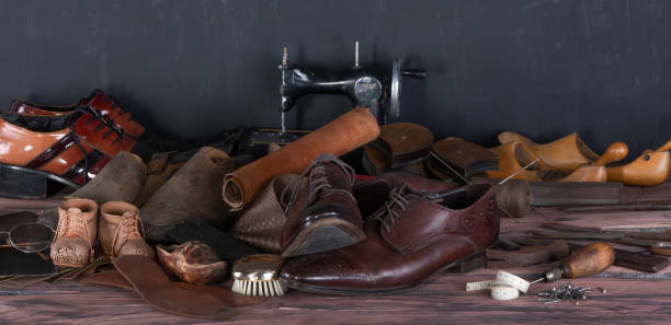 istock wooden shoemaker table for shoe repair 2155977512