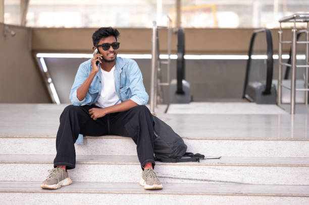 istock Young man using smart phone outdoors 2155978404