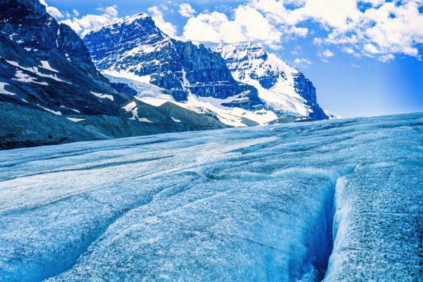 Glacier in the rocky mountains with cracks in the ice