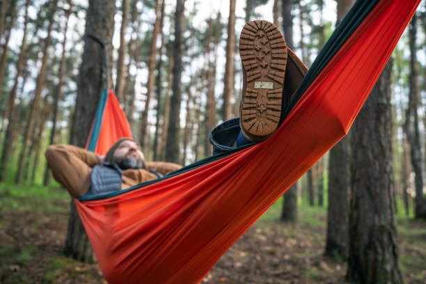 istock A man relaxing in hammock in the pine woodland 2155978992