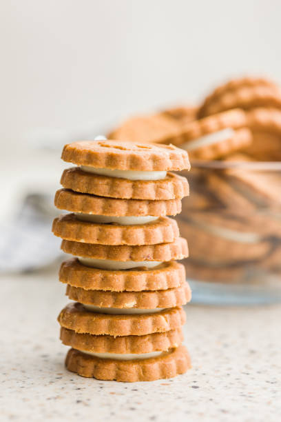istock Stack of Cream Filled Cookies on Countertop 2155980023